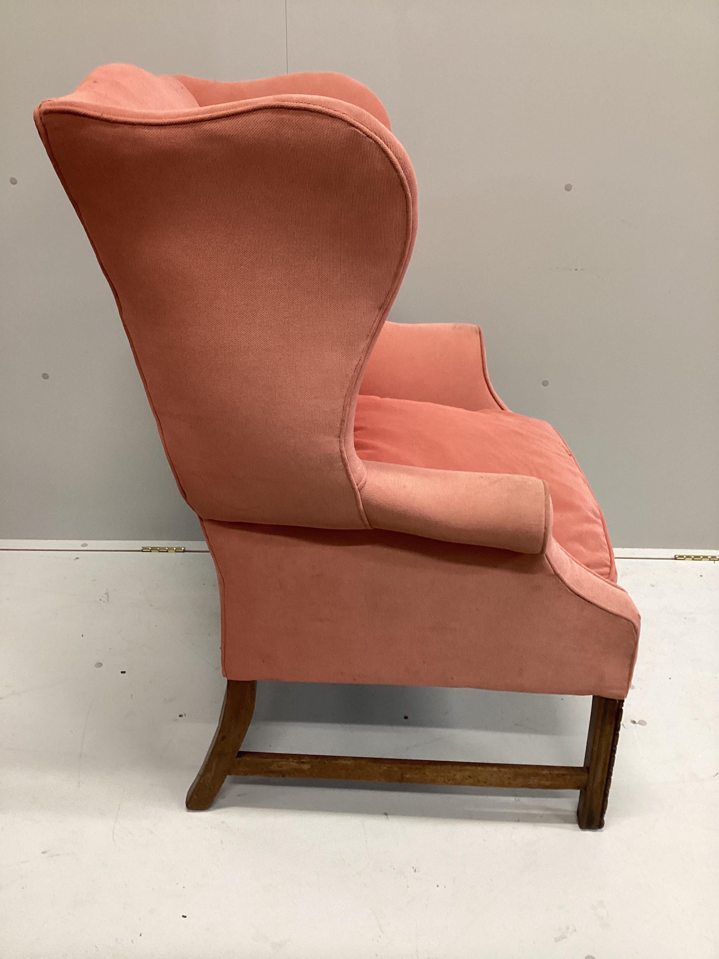 A George III style upholstered wing armchair, width 80cm, depth 80cm, height 110cm